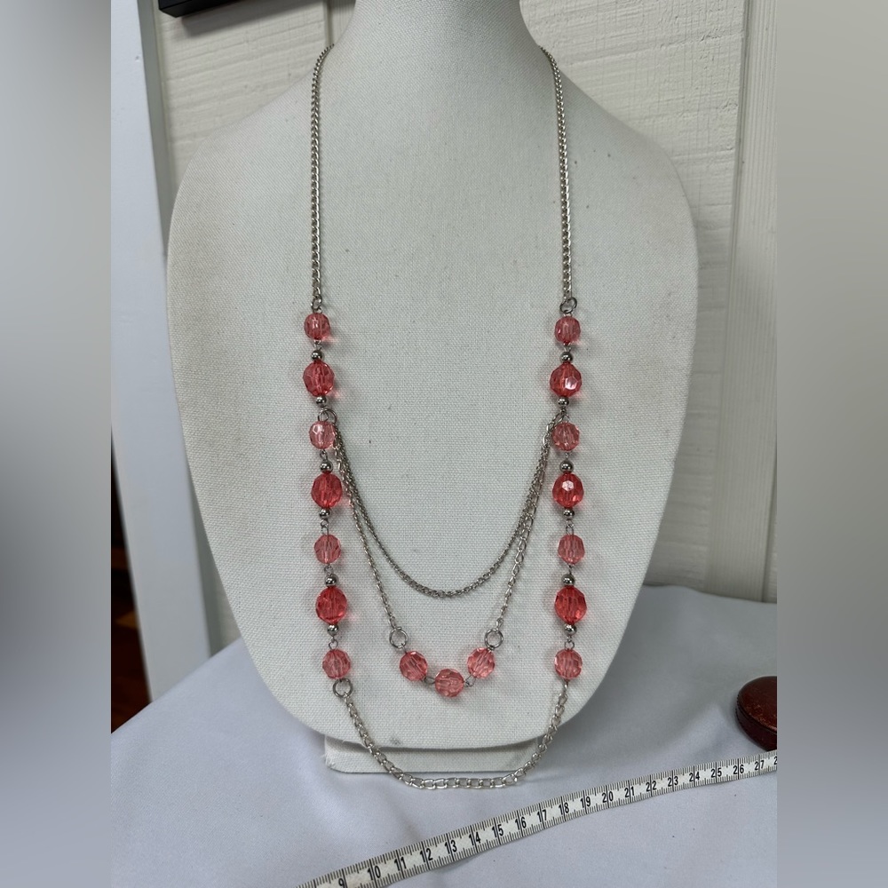 Long silvertone necklace with peachy pink beads